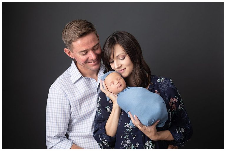 Family newborn boy portrait photography in studio.