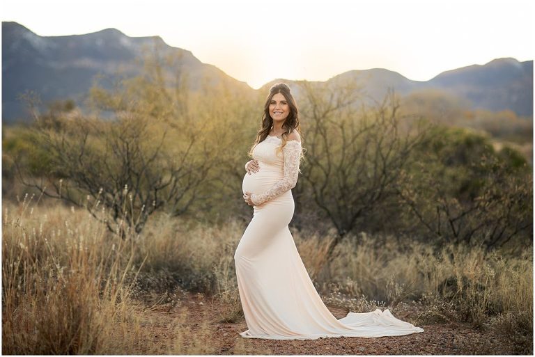 Maternity session with new mom in Sierra Vista with mountain views. Mom in cream lace dress.