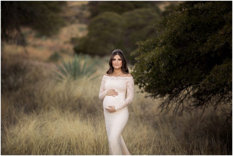 Maternity session with new mom in Sierra Vista with mountain views. Mom in cream lace dress.