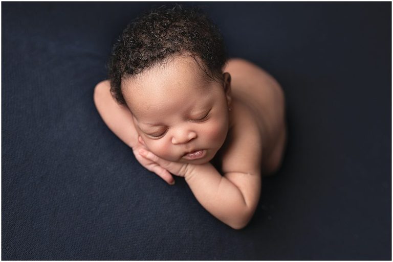 Newborn picture with navy background. Studio located in Sierra Vista, Arizona. 