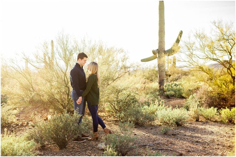 A collection of perfectly timed sunset engagement  photos with a whimsical vibe set against the backdrop of desert cacti in Saguaro National Park in Tucson Arizona.