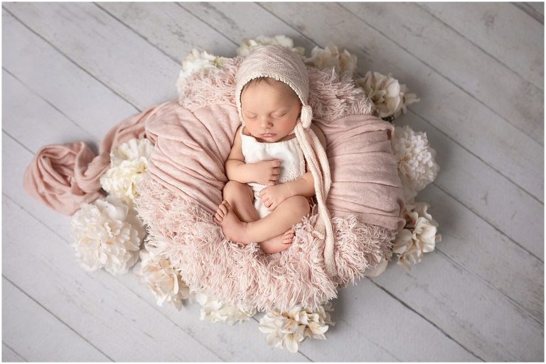 newborn pictures, soft, flowery, cream and pink with lots of texture.